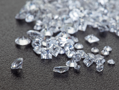 Loose diamonds on black surface